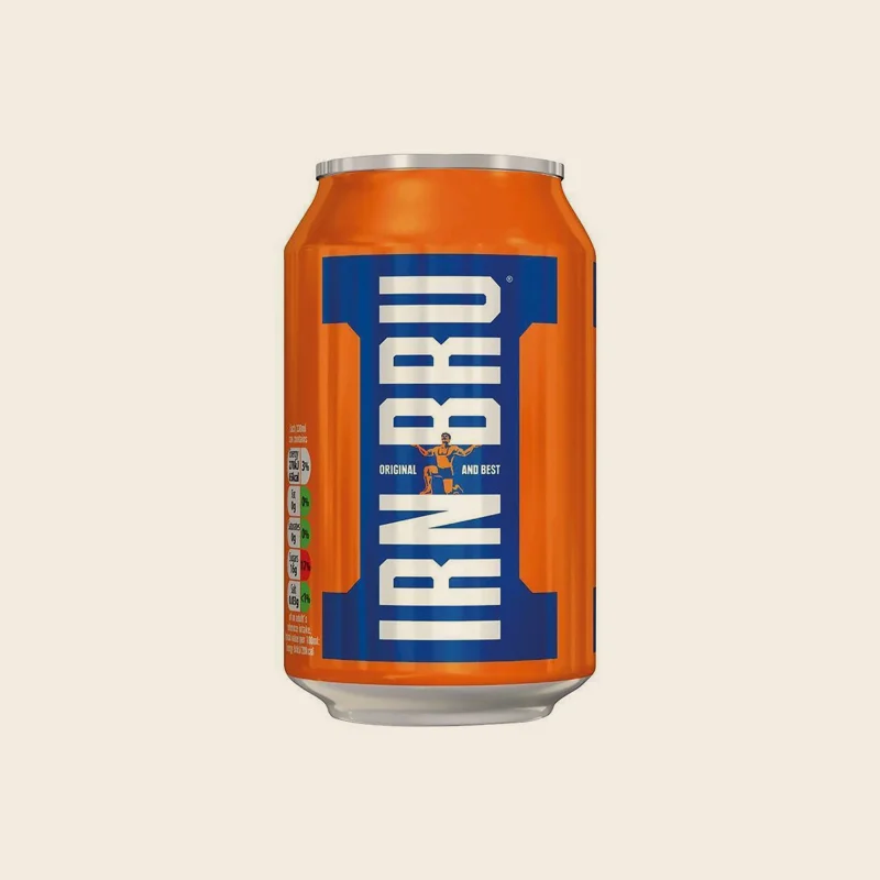 A chilled can of Irn Bru on a dark table