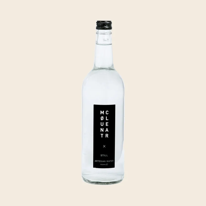 A 750ml glass bottle of Mount Clear still artesian water
